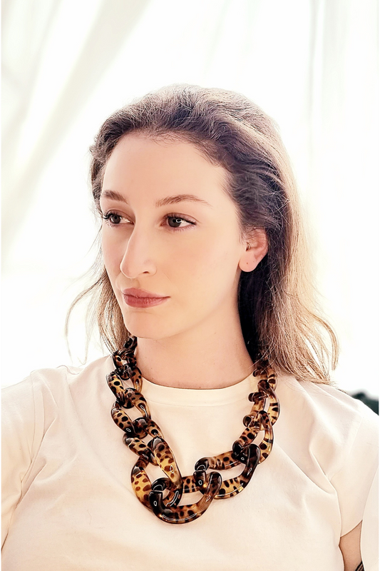 Model wearing brown leopard print chain necklace