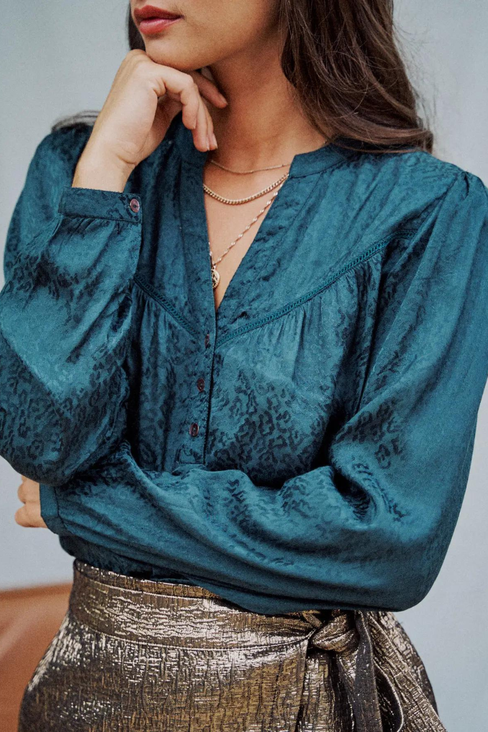 Model wearing a green leopard print, long Sleeve Blouse