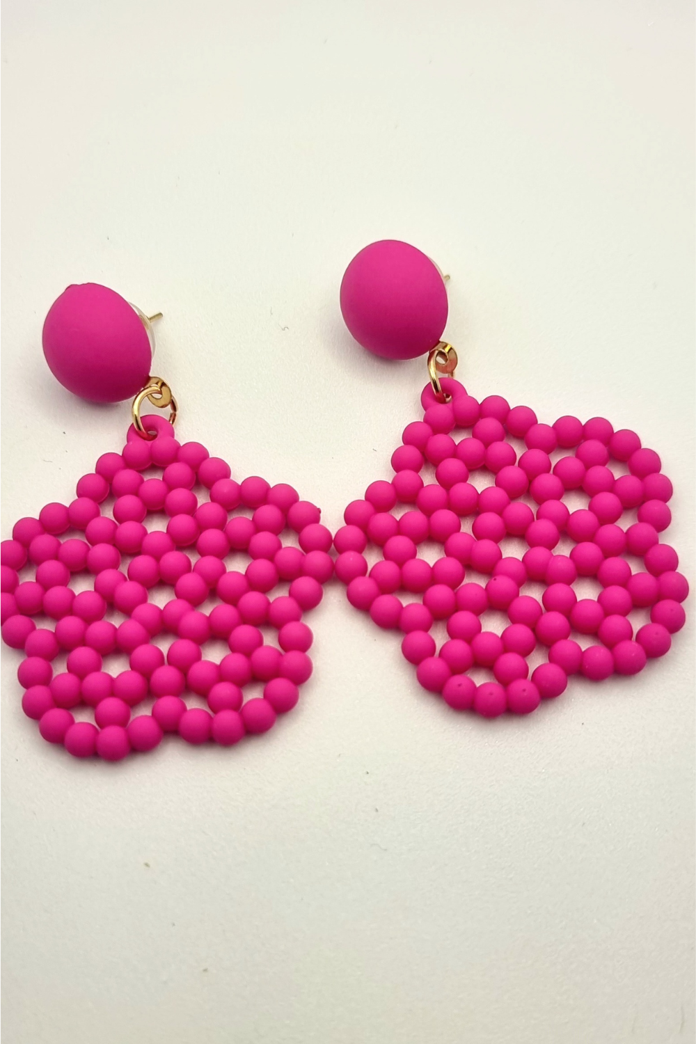 Pink beaded flower drop earring.