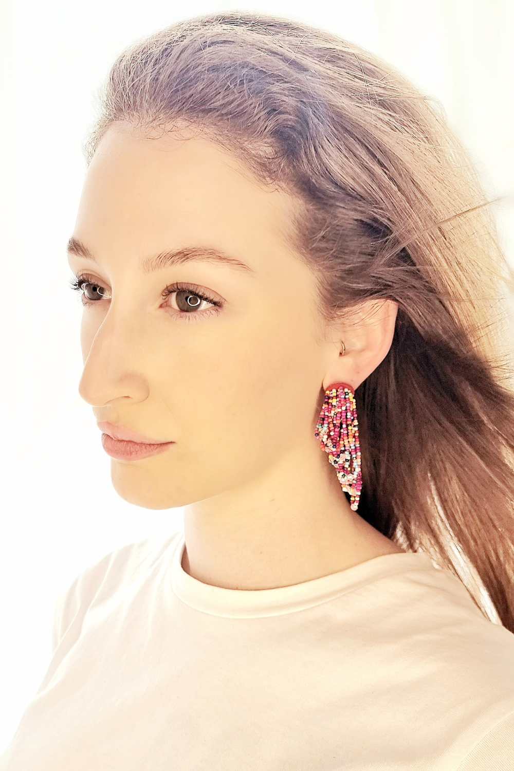 Girl wearing Beaded tassel drop earrings