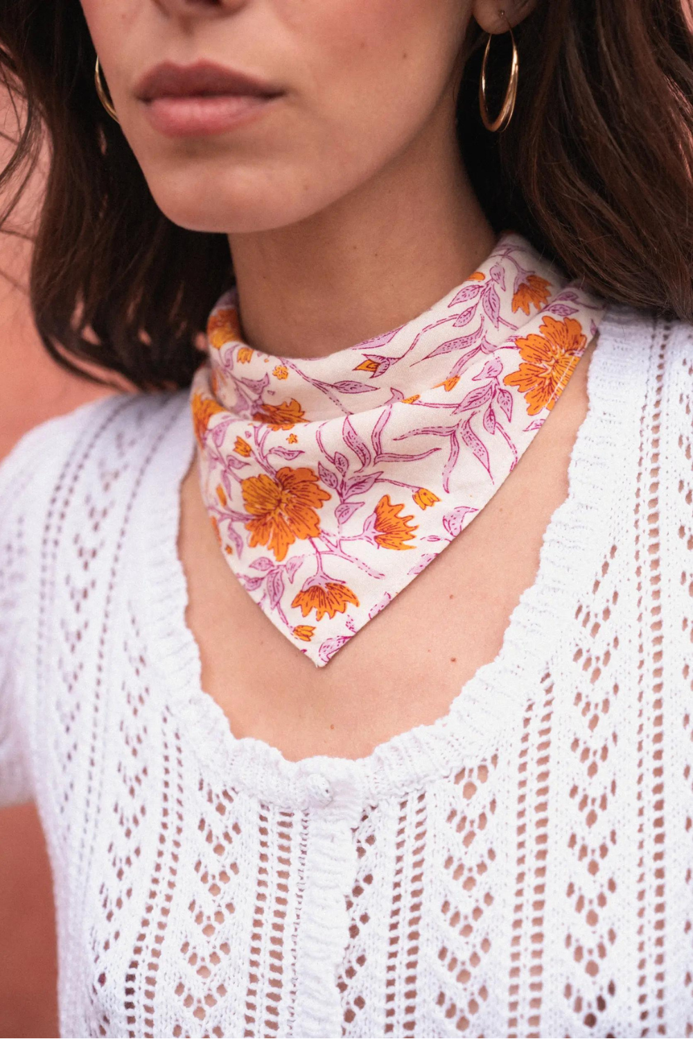 woman wearing a flower neck scarf