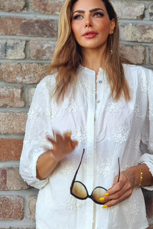 Model wearing embroidery detail white shirt